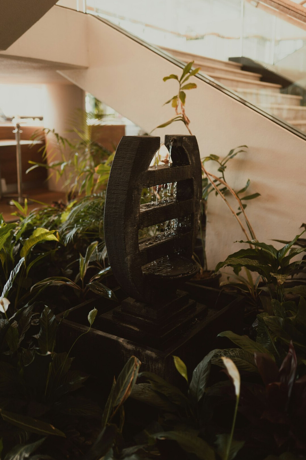 Reception area of a modern office with plants and seating