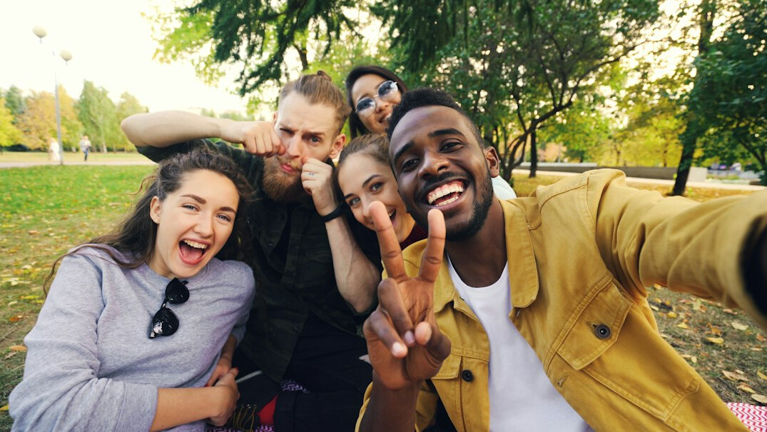 diverse young friends laughing