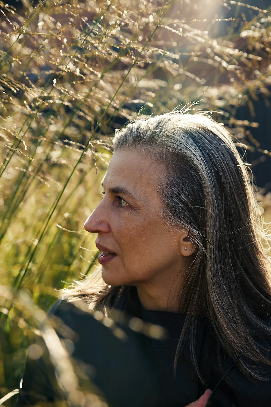 Studio portrait of a German woman in her fifties with short grey hair